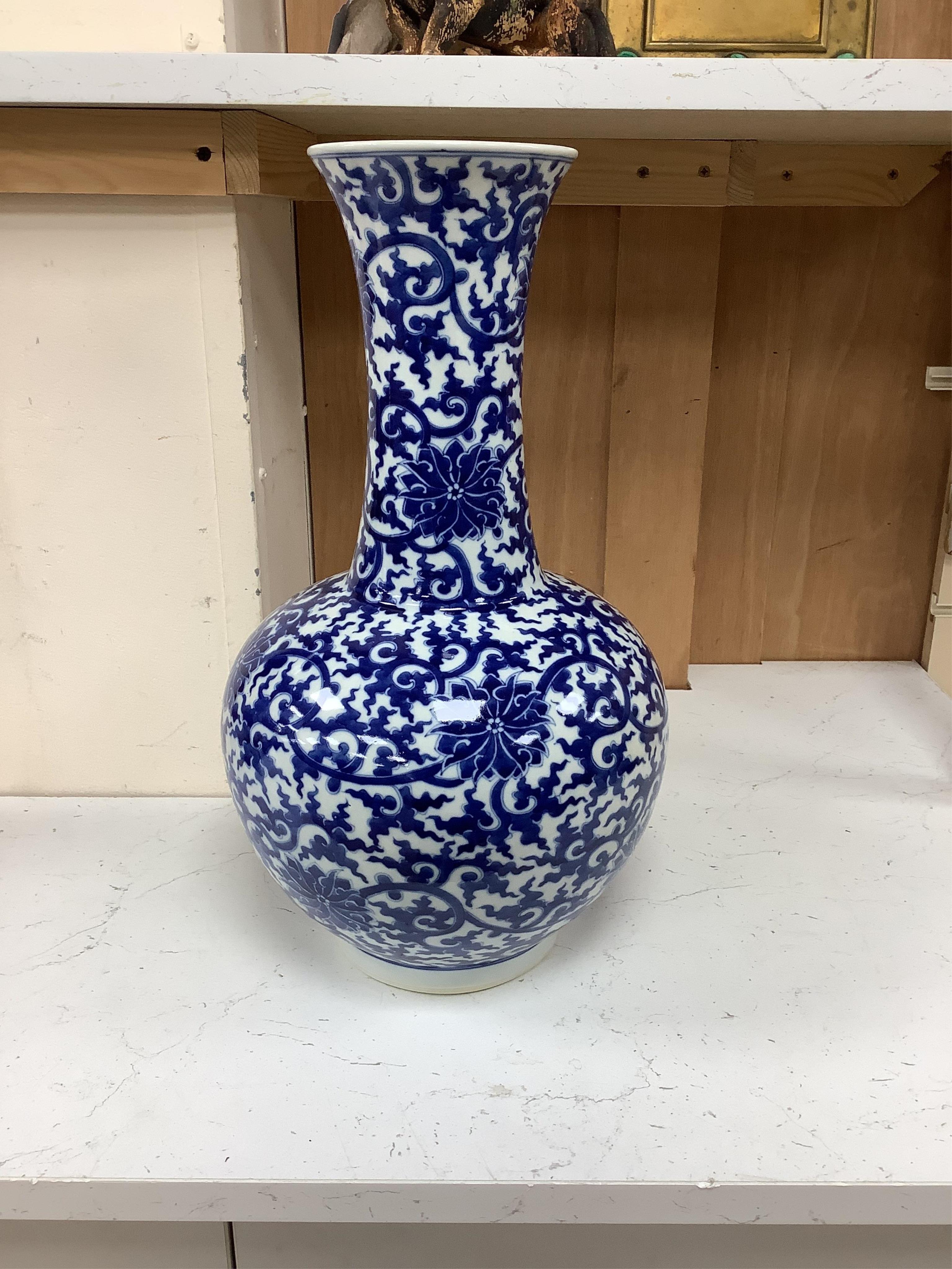 A large Chinese blue and white vase, 42cm high. Condition - good